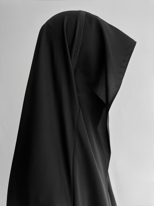 Indonesian Style Khimar in black, side view close-up"