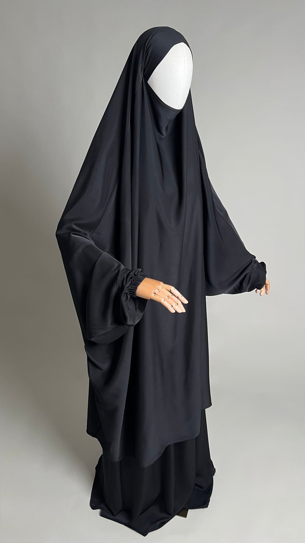 Black Sumayyah Two-Piece Jilbab, three-quarter view showing the long khimar and matching skirt