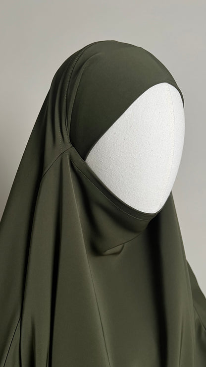 Close-up of the olive green Sheimaa Rounded Khimar around the face and chin