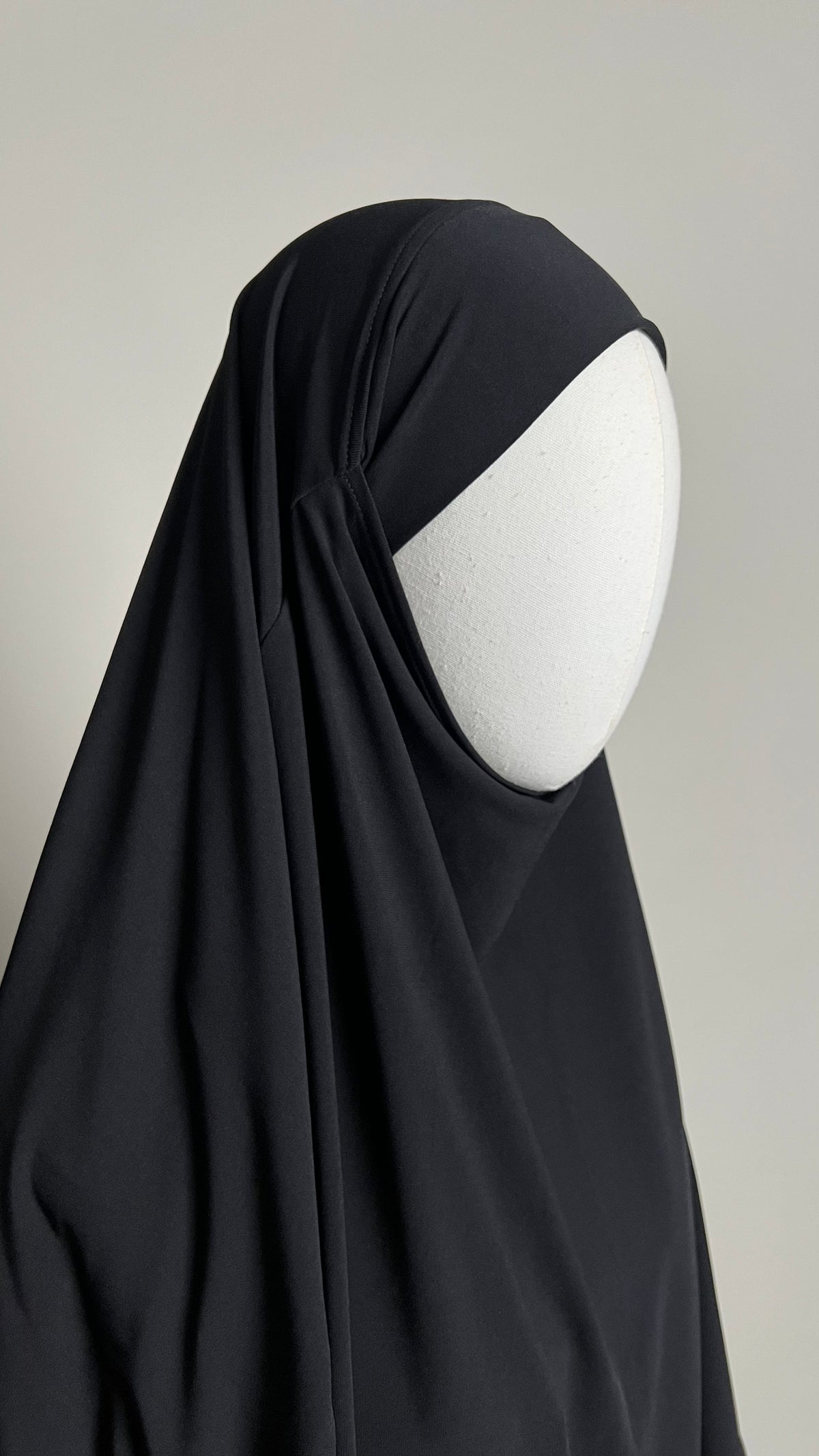 Black Yasmin Jersey Khimar, close-up three-quarter view around the face