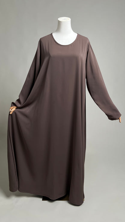 Coffee Safiyyah Closed Abaya, front view with the hem held out to show the A-line width