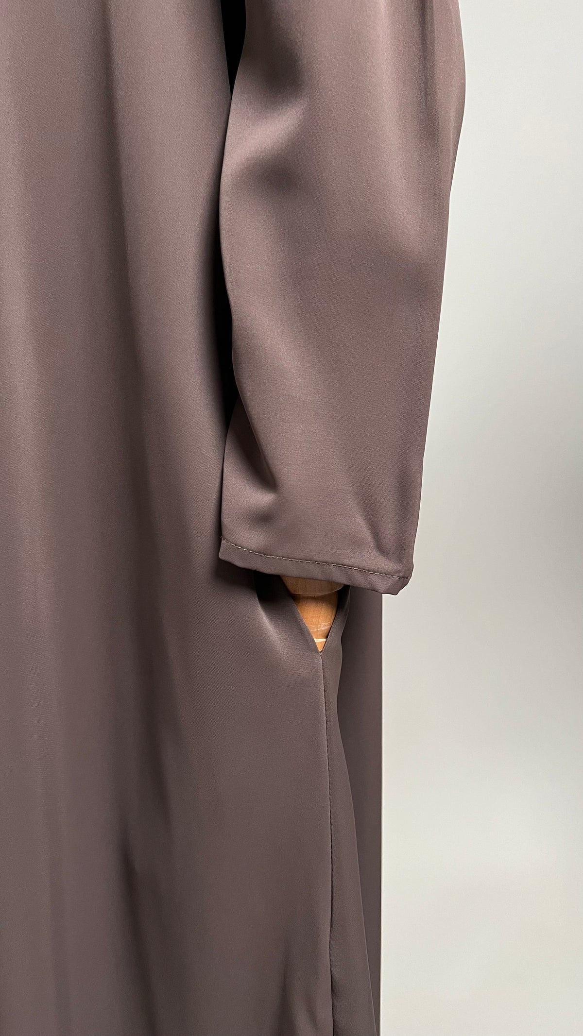 Close-up of the sleeve and side pocket on the coffee Safiyyah Closed Abaya