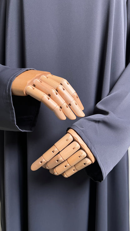 Close-up of the sleeve openings on the dark grey Safiyyah Closed Abaya