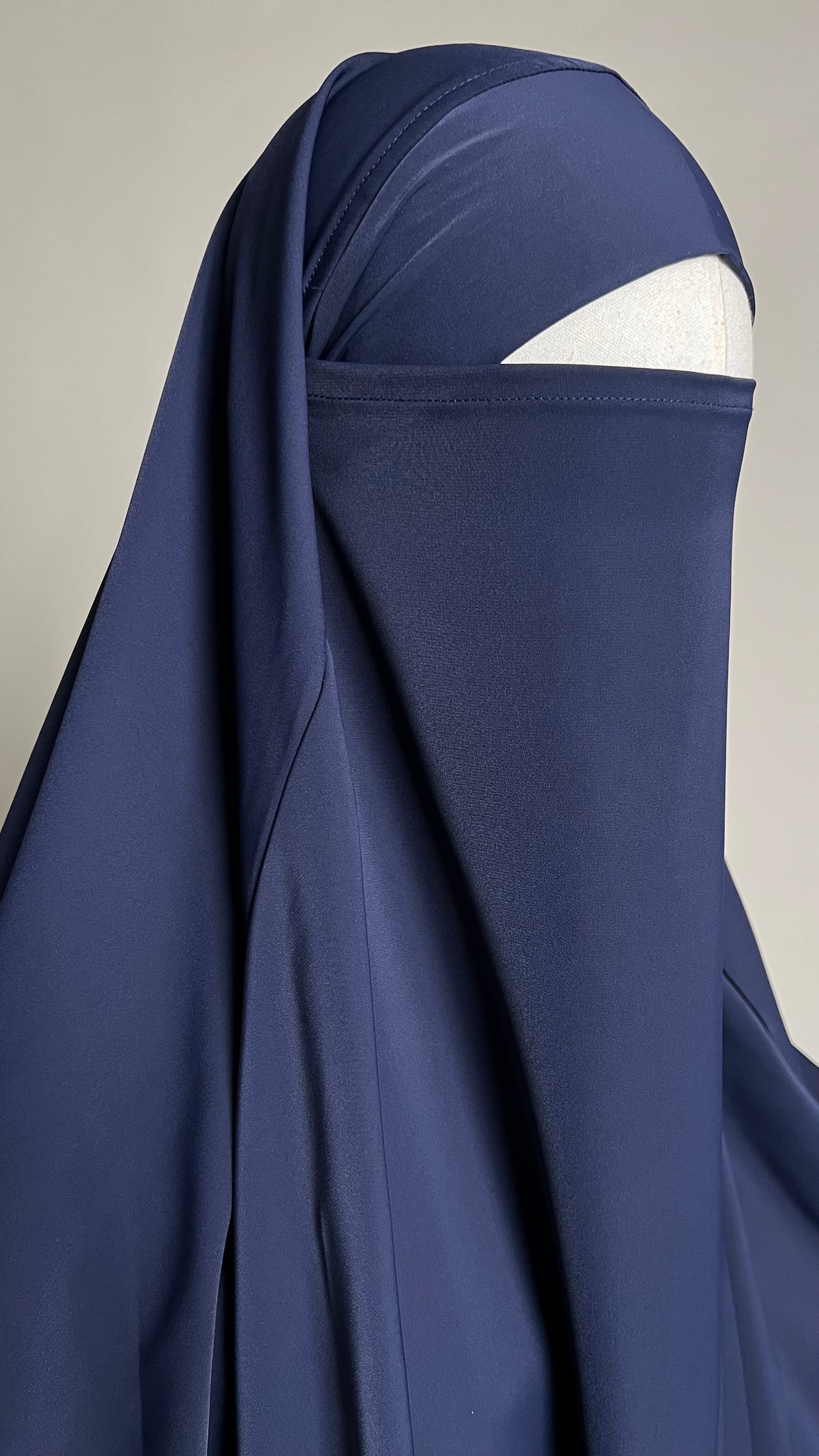 Close-up of the Baritone Blue Zaynab One-Piece Jilbab around the head, worn with a niqab