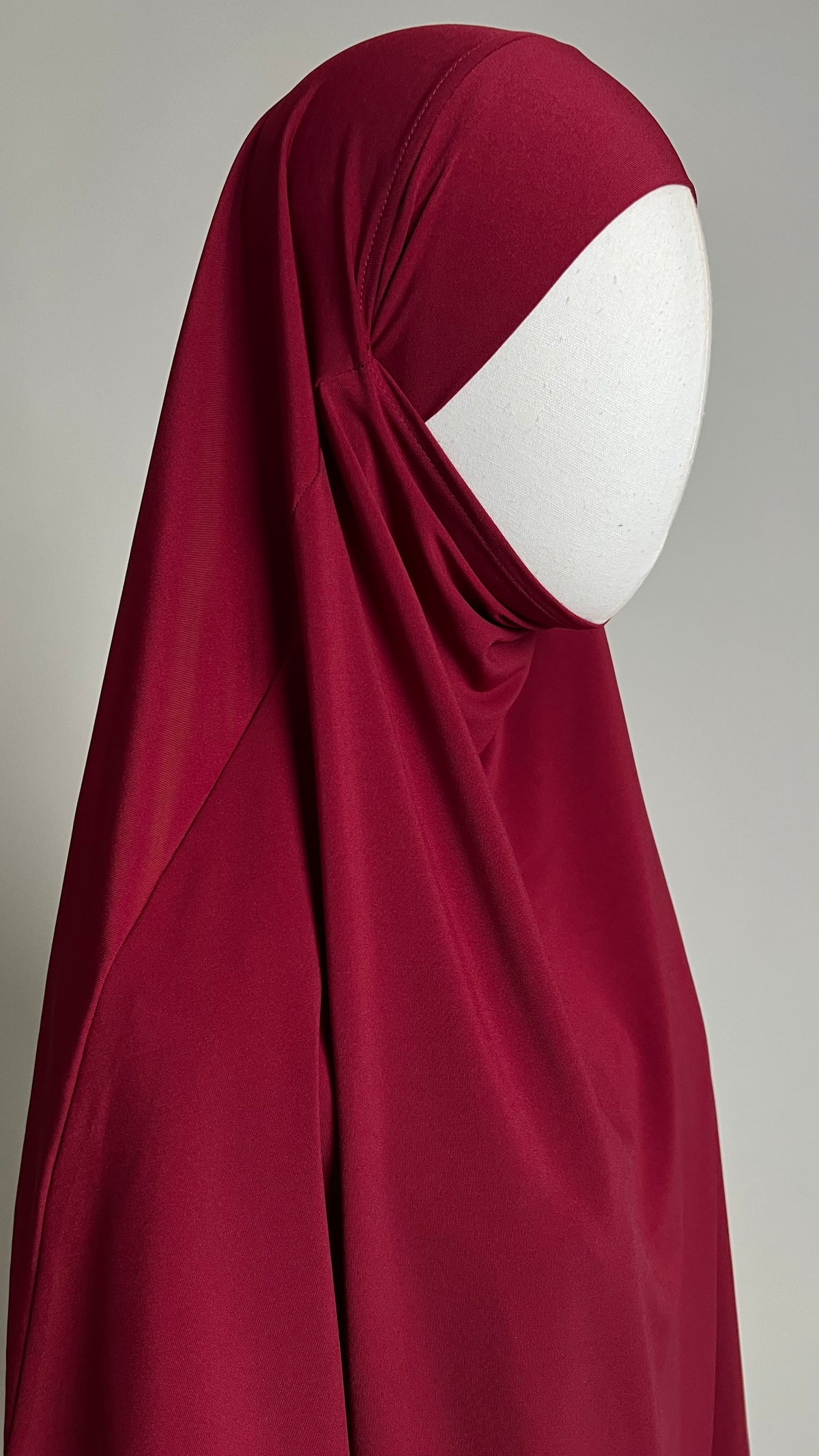 Burgundy Yasmin Jersey Khimar, close-up three-quarter view around the face