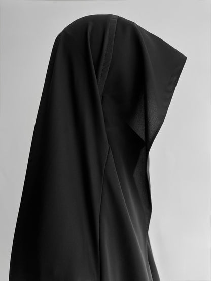 Indonesian Style Khimar in black, side view close-up"