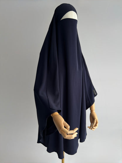 Indonesian Style Khimar in navy blue, full front view at 45 degrees on mannequin