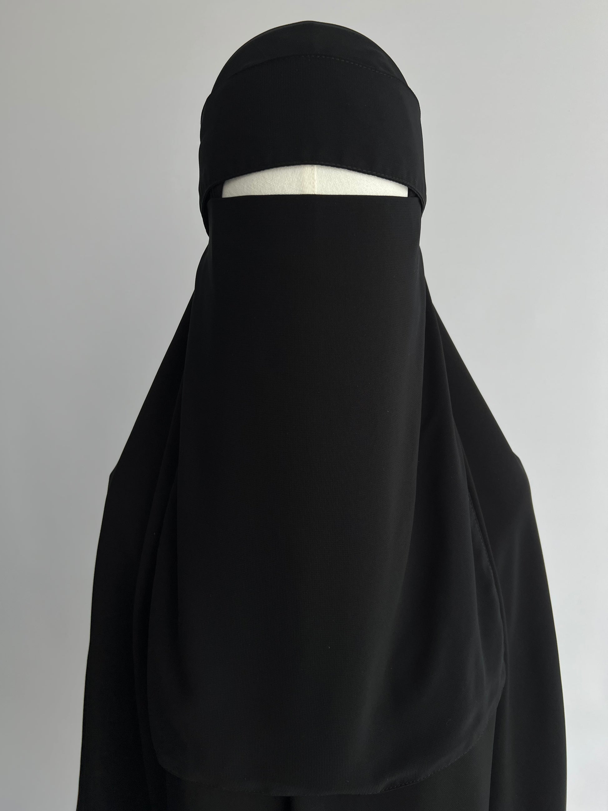 Niqab and Hijab Set in black, front view on mannequin