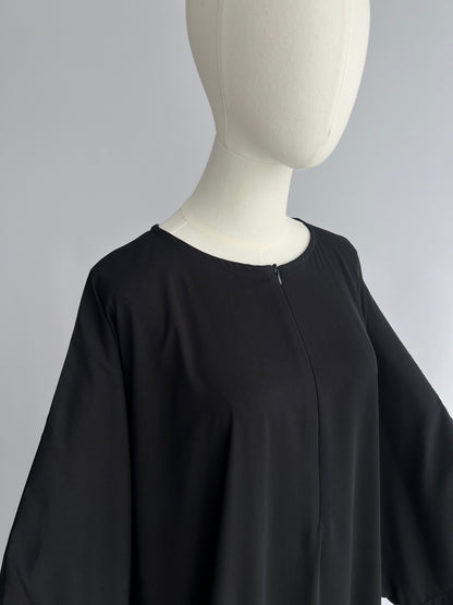 Essential Zip Abaya upper body detail, front view showing neckline and chest area