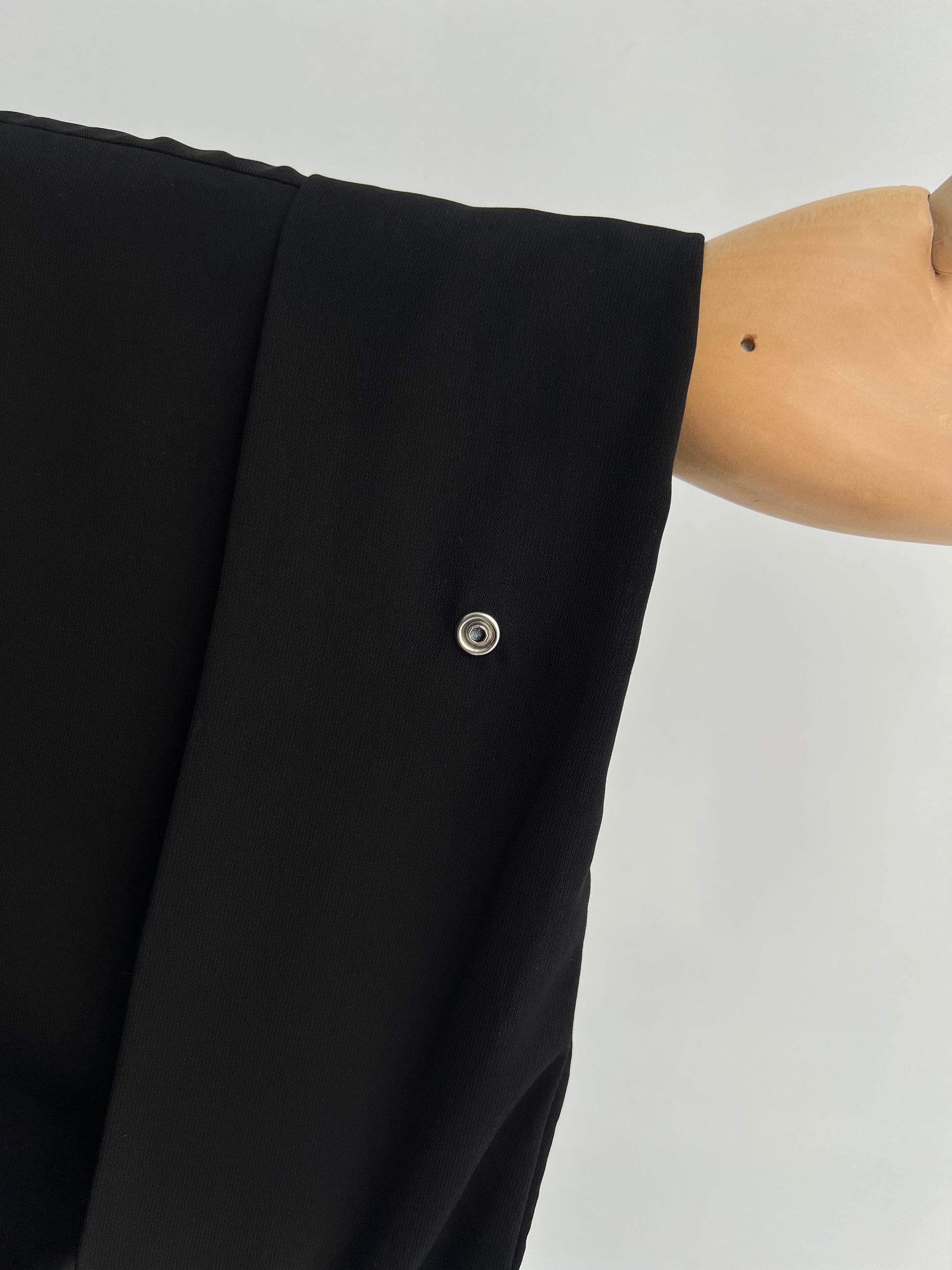 Close-up of sleeve interior showing button closure on Essential Zip Abaya