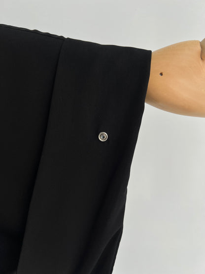 Close-up of sleeve interior showing button closure on Essential Zip Abaya