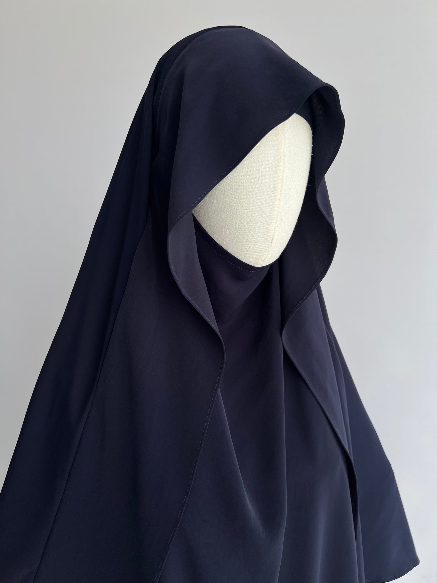 Indonesian Style Khimar in navy blue, front angled view at 45 degrees