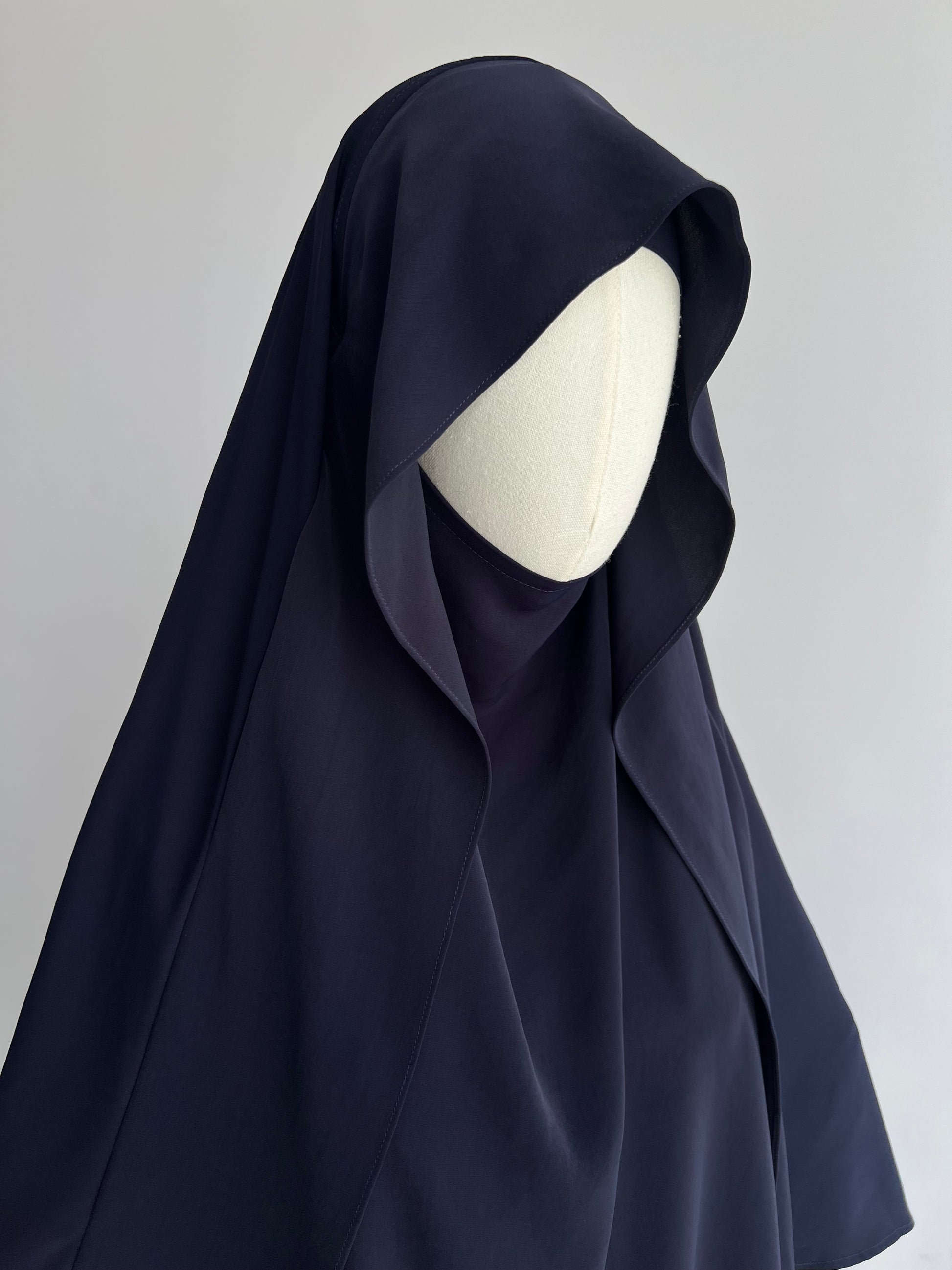 Indonesian Style Khimar in navy blue, front angled view at 45 degrees
